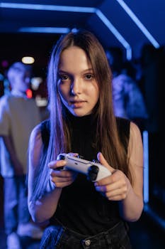 Teen girl focused on gaming with a controller in a neon-lit room.